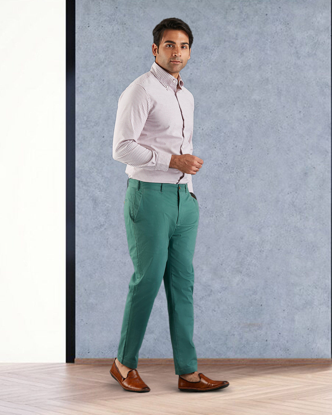 Model side view wearing custom Genoa Chino pants for men by Luxire in fern green hands together
